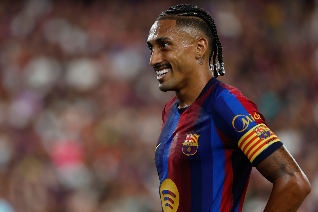 Barcelona star Raphinha smiles during a La Liga match against Athletic.