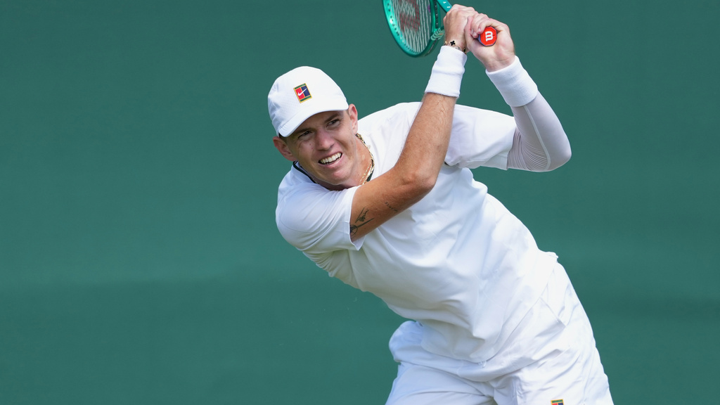 Tennis star Martin Damm takes a shot during the Wimbledon Tennis Championship.
