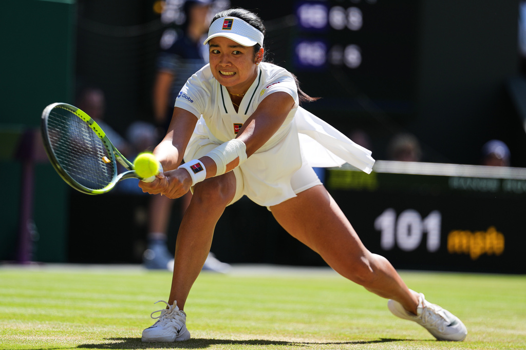 Alexandra Eala of the Philippines hits a return shot during the Wimbledon Tennis Championship.