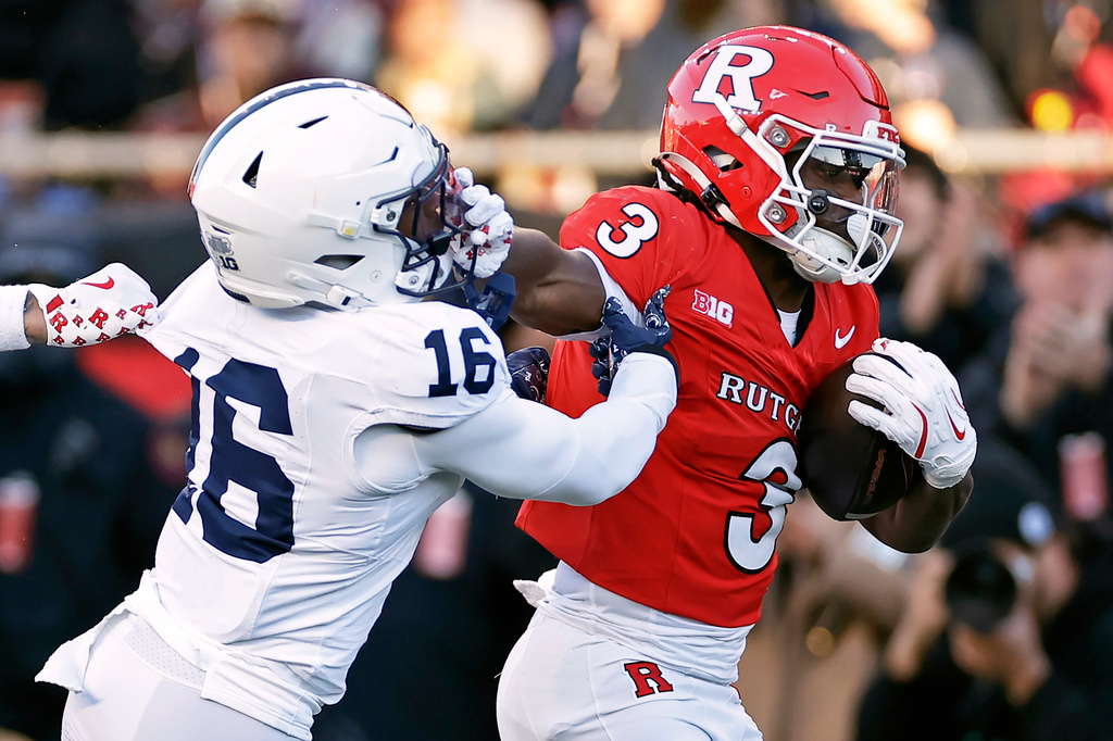 Rutgers running back Antwan Raymond (3) runs for a touchdown past Penn State safety King Mack (16) during the first half of an NCAA college football game, Nov. 29, 2025, in Piscataway, N.J.