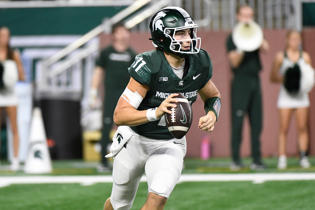 Michigan State QB Alessio Milivojevic rolls out, looking for a passing attempt vs. Maryland.