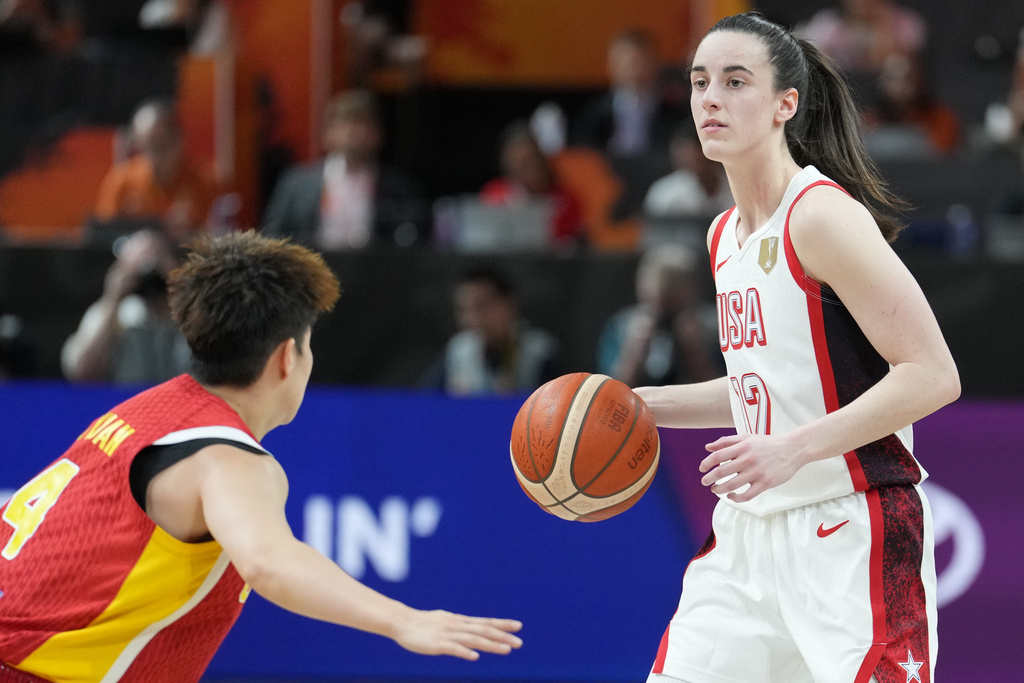 USA G Caitlin Clark handles the ball in a FIBA World Cup game vs. China.