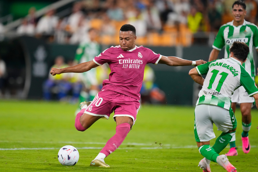 Real Madrid ST Kylian Mbappé attempts a shot on goal vs. Real Betis in a La Liga match.