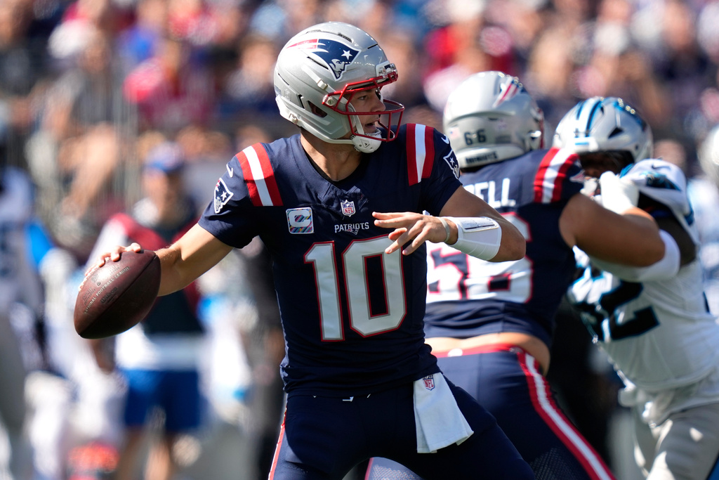 New England Patriots quarterback Drake Maye (10) throws a pass against the Carolina Panthers during the first half of an NFL football game.