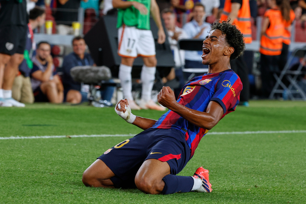 Barcelona's Lamine Yamal celebrates a goal during a La Liga match vs. Rayo Vallecano.