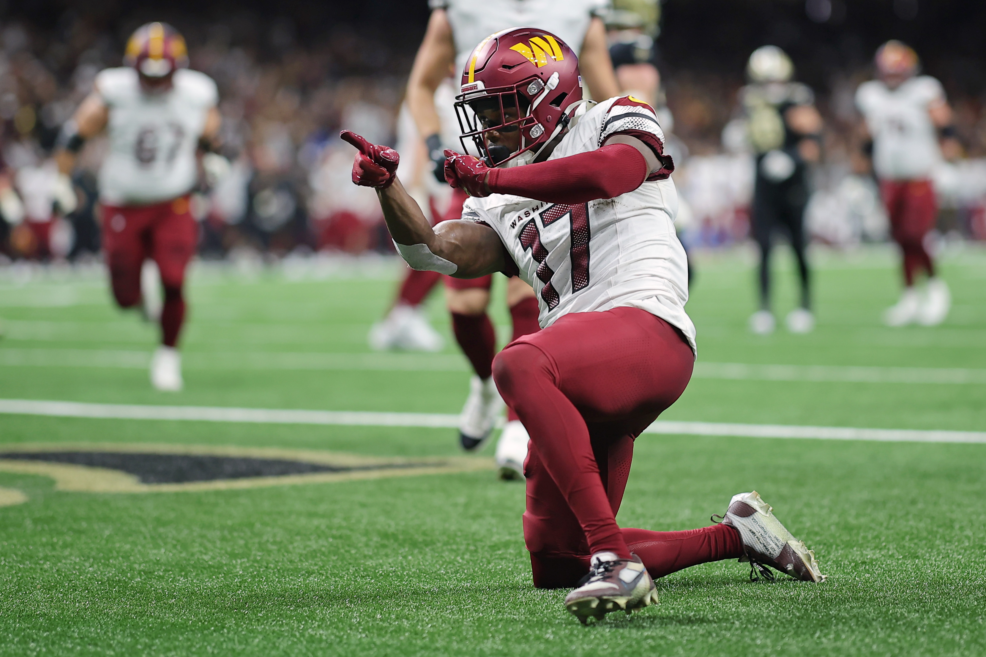 Washington Commanders WR Terry McLaurin reacts to a TD scored against the New Orleans Saints.