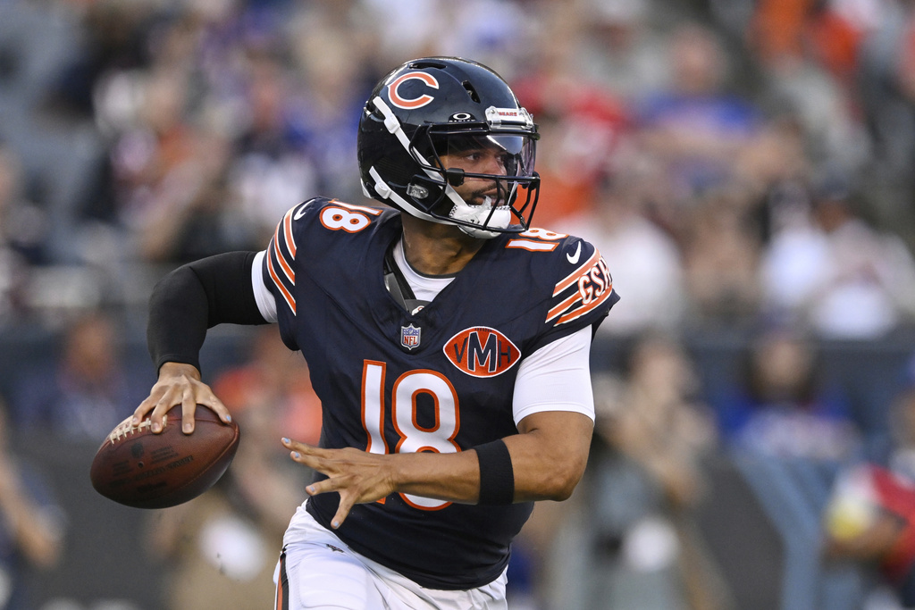 Bears QB Caleb Williams rolls out of the pocket in a preseason game vs. the Bills.