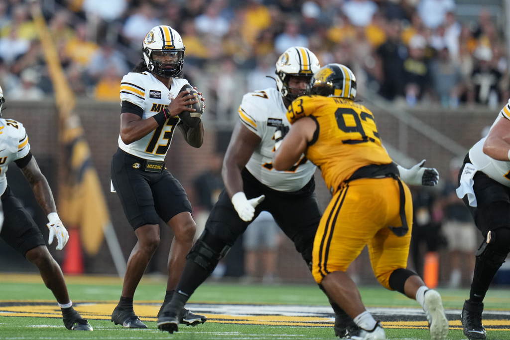 Missouri Tigers QB Austin Simmons drops back during a college football game against Arkansas-Pine Bluff.