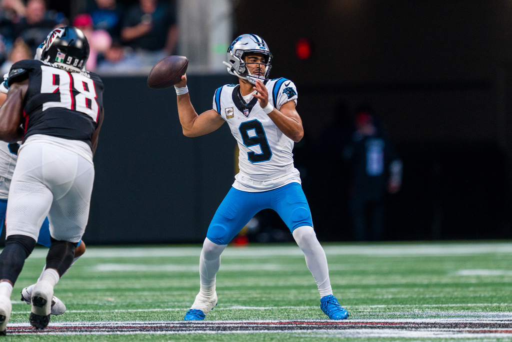 Panthers QB Bryce Young sits in the pocket and makes a passing attempt vs. the Falcons.