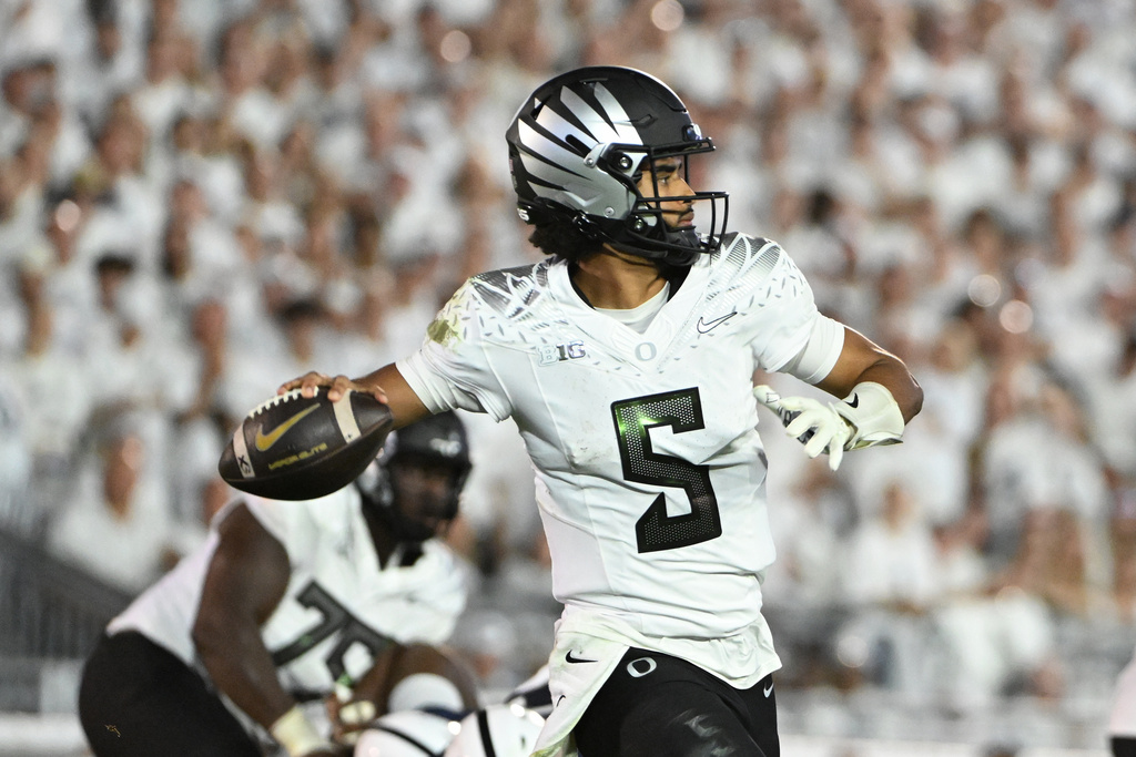 Oregon QB Dante Moore looks downfield for a passing attempt against Penn State.