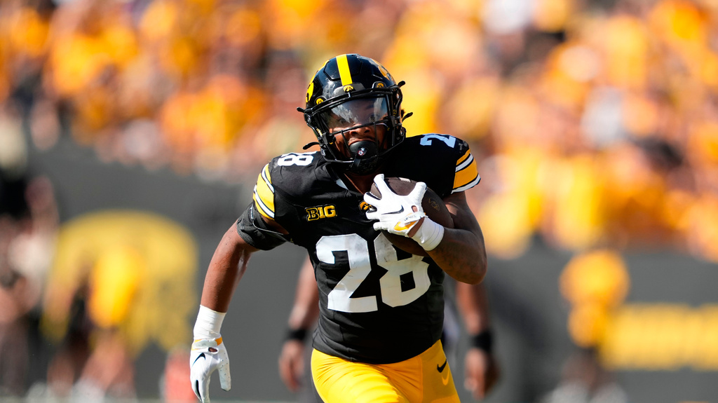 Iowa RB Kamari Moulton runs during a college football game against Northern Illinois.