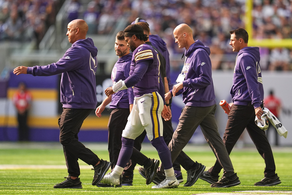 Minnesota Vikings QB Kyler Murray walks off the field following a big hit against the Green Bay Packers.