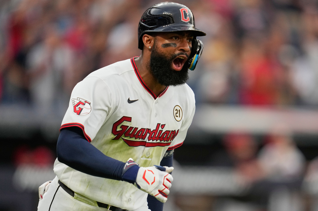 Cleveland Guardians OF Jo Adell runs during an MLB game against the Chicago White Sox.