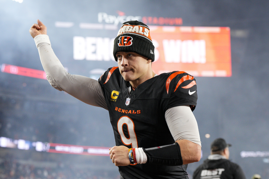 Bengals QB Joe Burrow gestures as he runs off the field following a game vs. the Broncos.