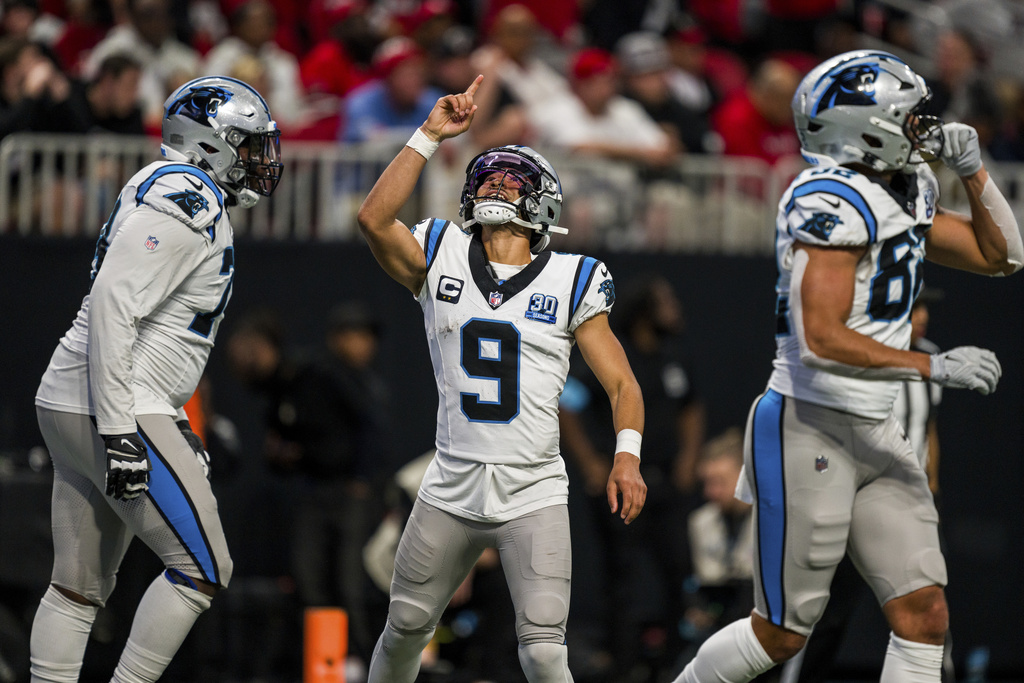 Carolina Panthers QB Bryce Young celebrates during an NFL game against the Atlanta Falcons.