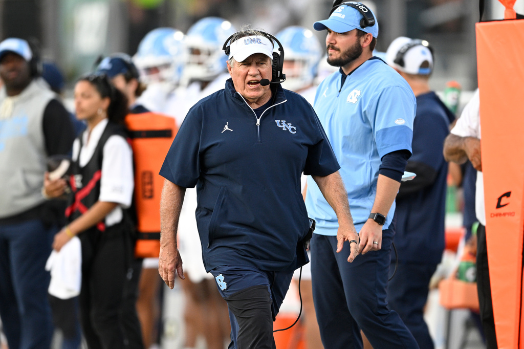 North Carolina head coach Bill Belichick, center, reacts on the sideline during the second half of an NCAA football game against Central Florida, Saturday, Sept. 20, 2025, in Orlando, Fla.