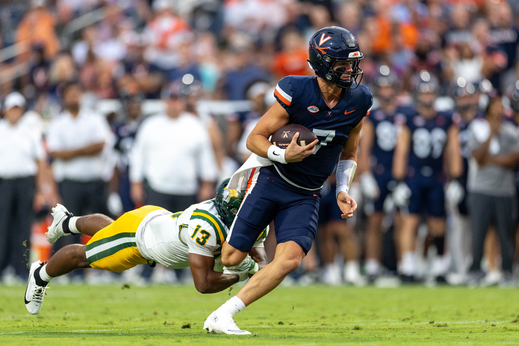 Virginia QB Beau Pribula runs during a college football game vs. Norfolk State.