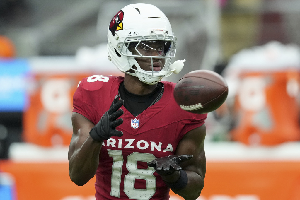Cardinals WR Marvin Harrison Jr. warms up before a game vs. the Panthers.