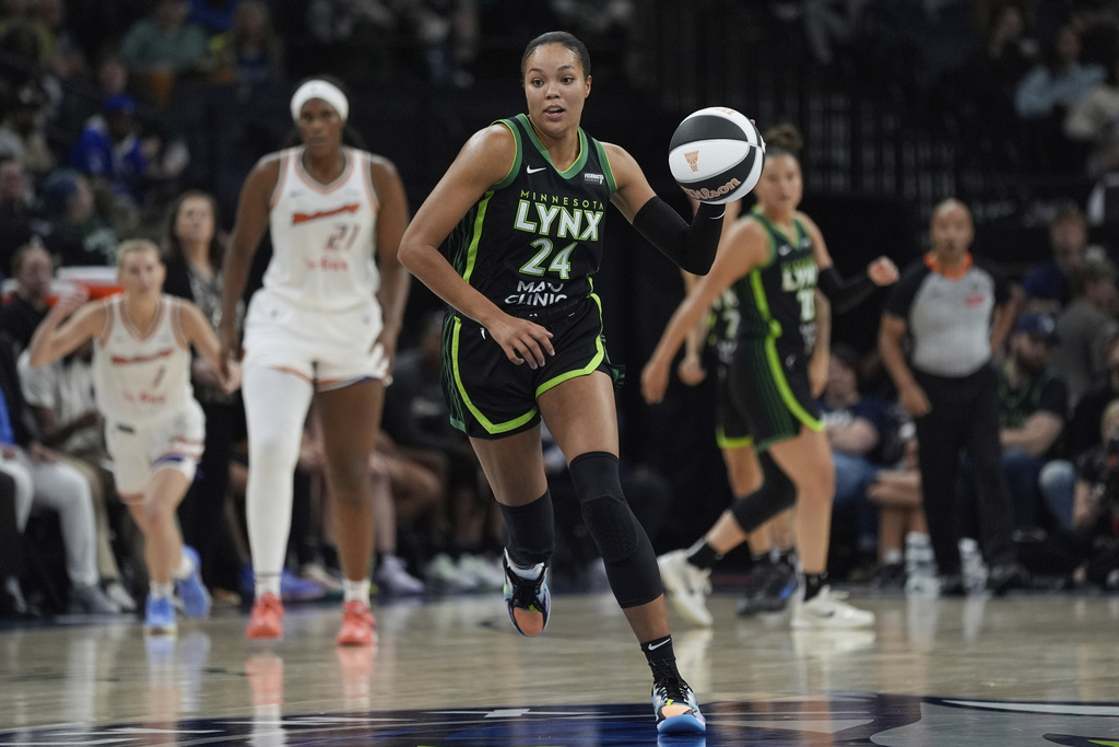 Lynx F Napheesa Collier dribbles the ball upcourt vs. the Mercury.