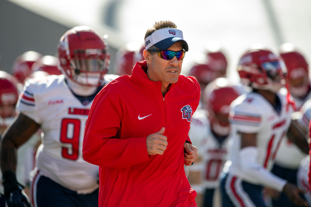 Liberty head coach Jamey Chadwell leads his team onto the field for a game vs. UTEP.