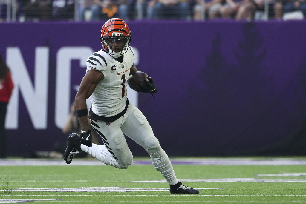 Bengals WR Ja'Marr Chase runs with the ball after the catch vs. the Vikings.