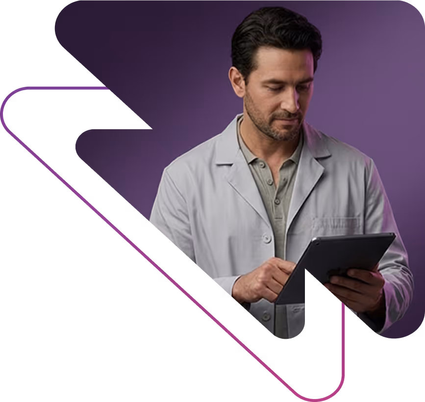 A man wearing a light gray lab coat using a digital tablet against a purple background.