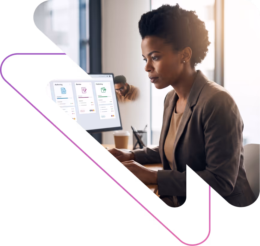 Woman in a blazer working focused on a computer displaying a project management dashboard with columns for Authoring, Review, and Publishing.
