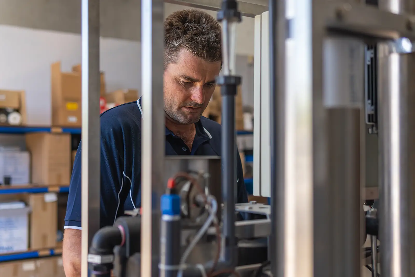 CITOR technician working on a reverse osmosis system in the Perth workshop