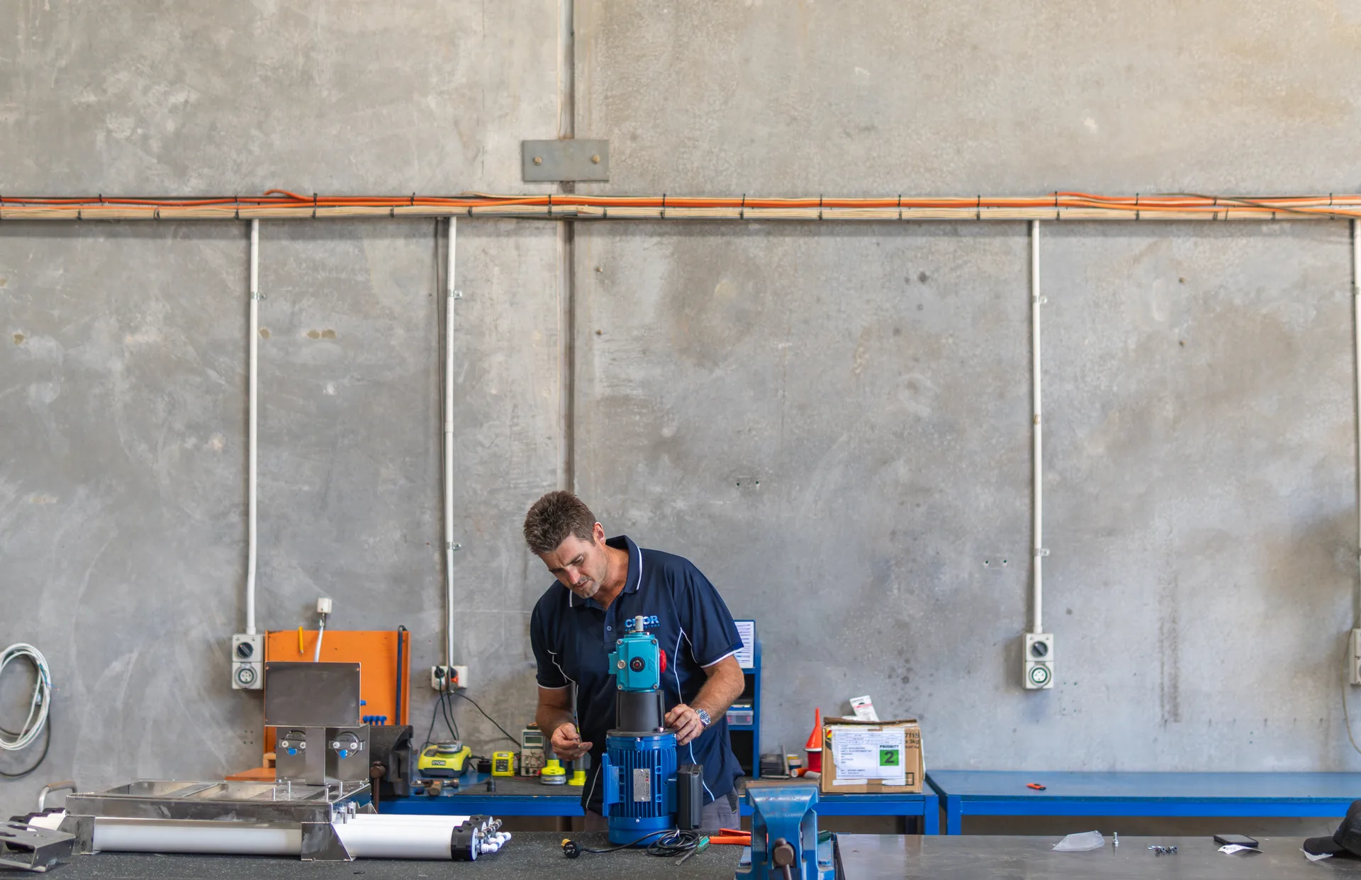 CITOR technician assembling a desalination unit in the Perth workshop