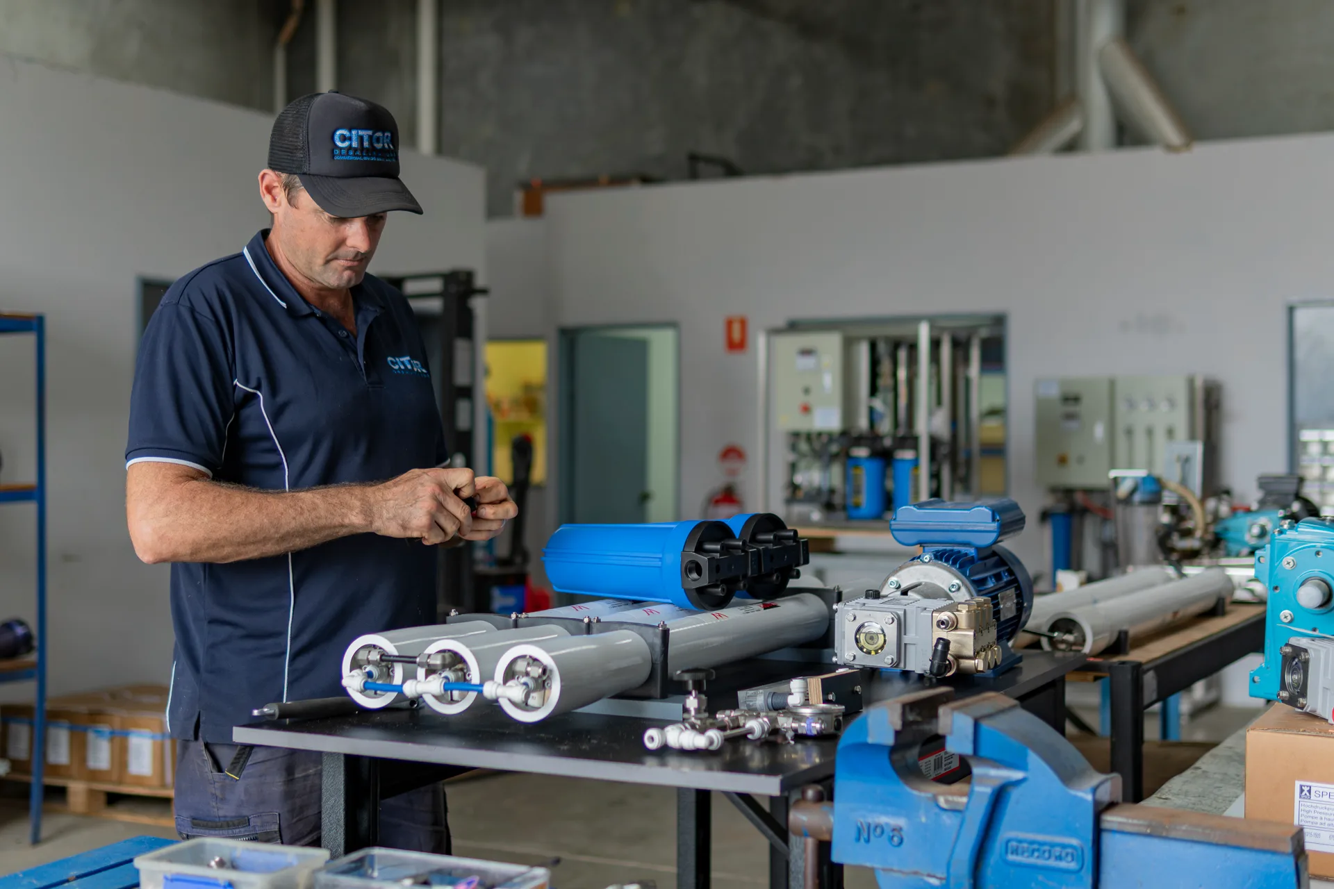 CITOR technician assembling a compact reverse osmosis unit