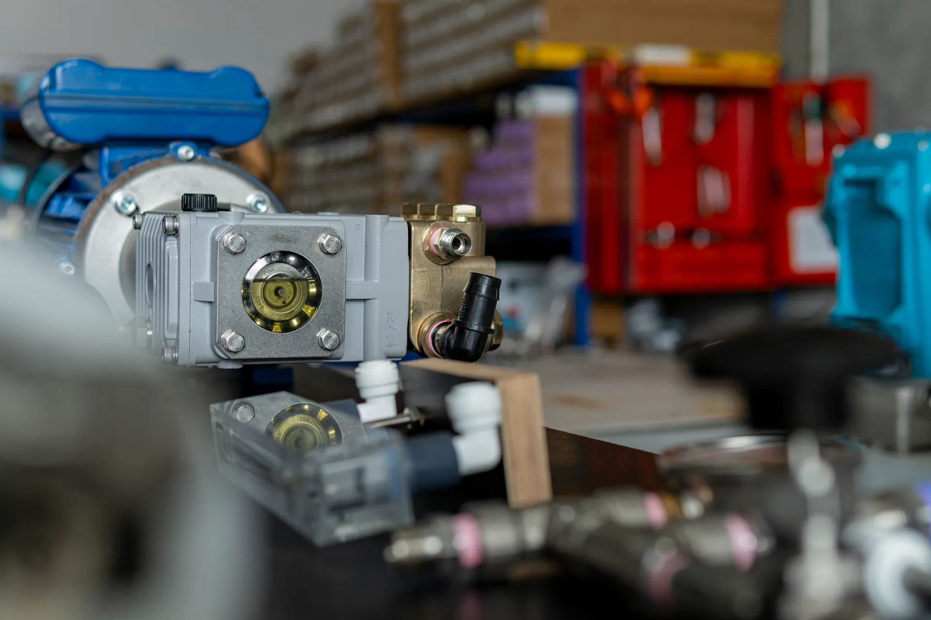 Close-up of a pump and valve assembly on the CITOR workshop bench