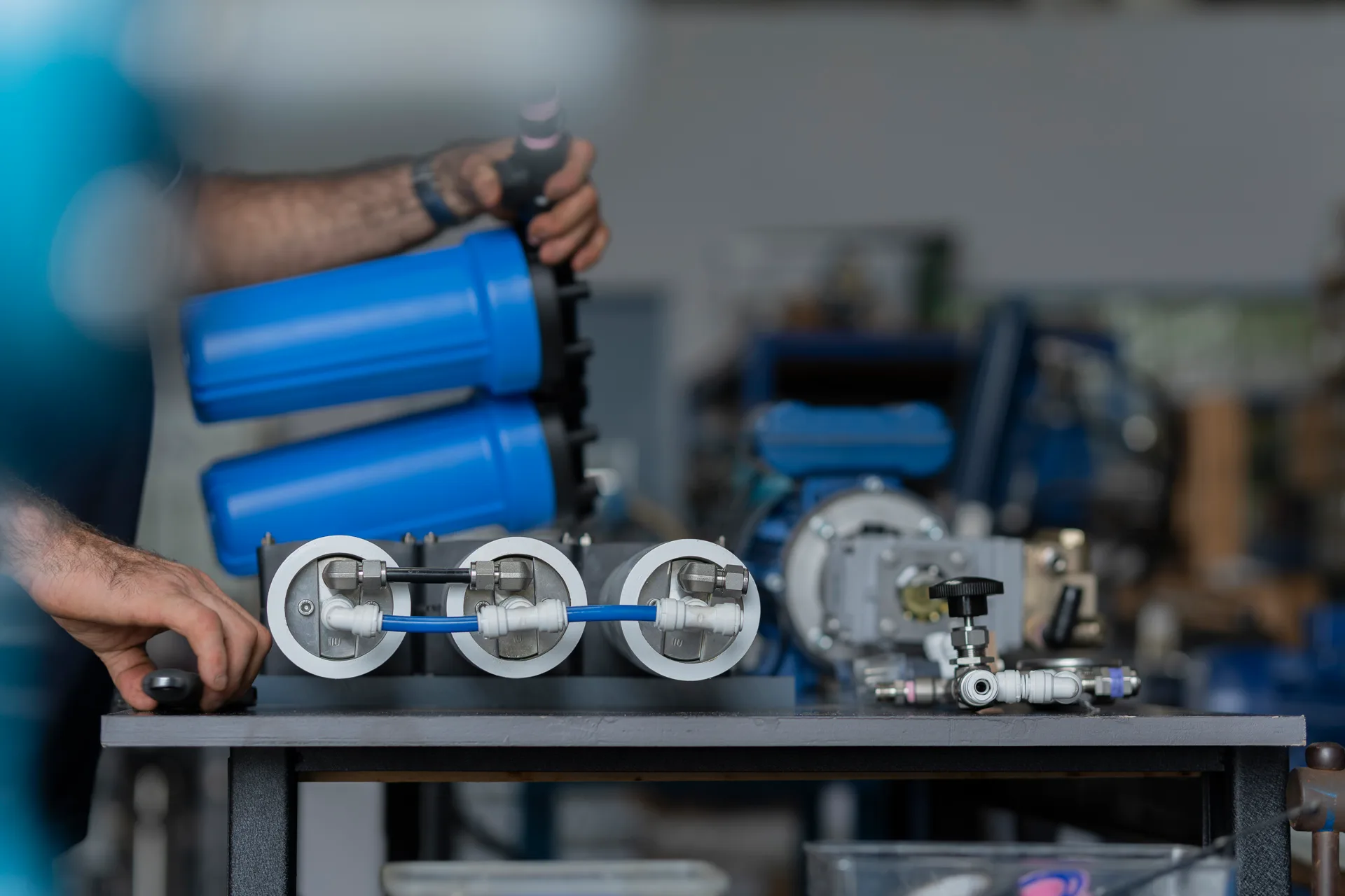 Technician assembling filter housings on a CITOR system