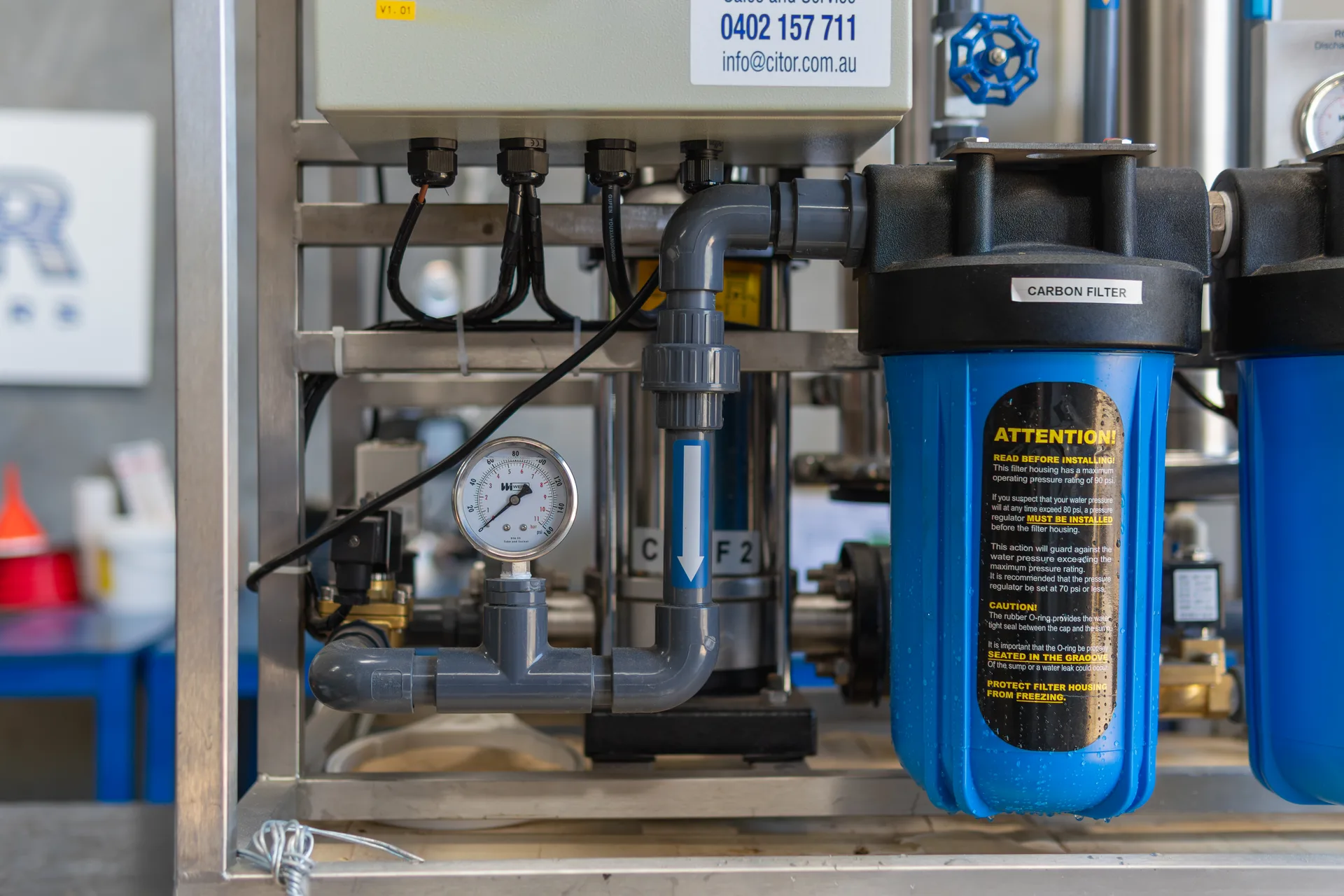 Pre-filter housings and pressure gauge on a CITOR reverse osmosis unit