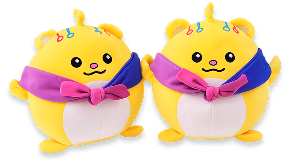 Two Plushie toys shown from front and side angles — a round yellow character with a purple-and-pink scarf and colorful accents