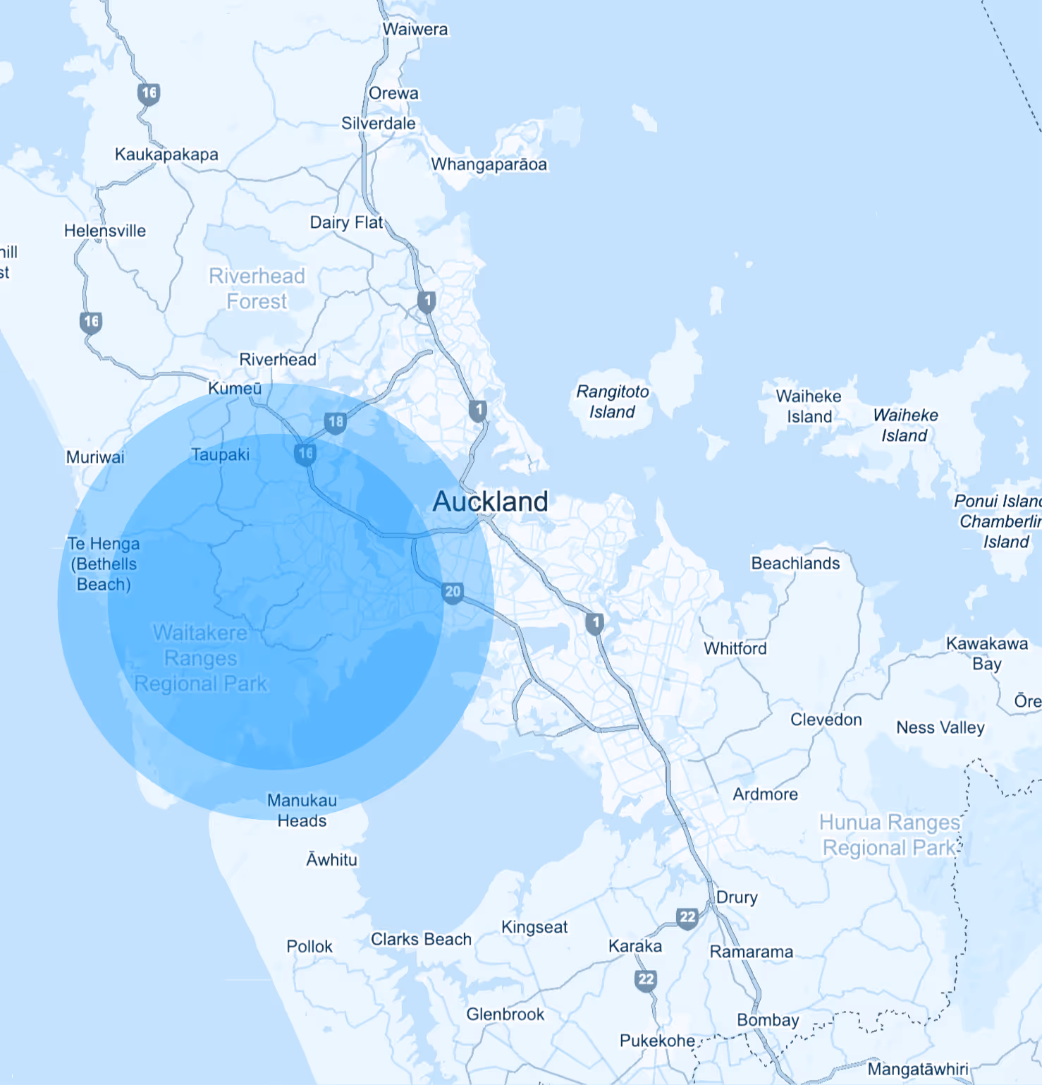 Map showing Auckland, New Zealand, with a blue circular overlay centered on Waitakere Ranges Regional Park and surrounding areas.