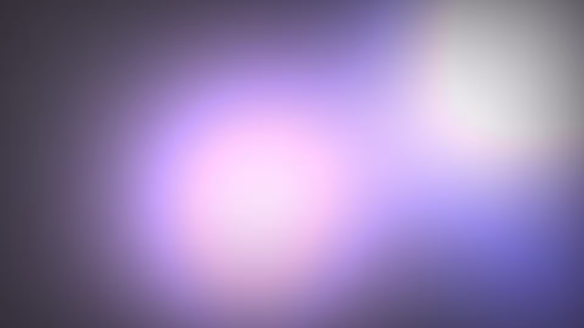 Weiches Licht verschwommen in Violett, Lila und Weiß auf dunklem Hintergrund.