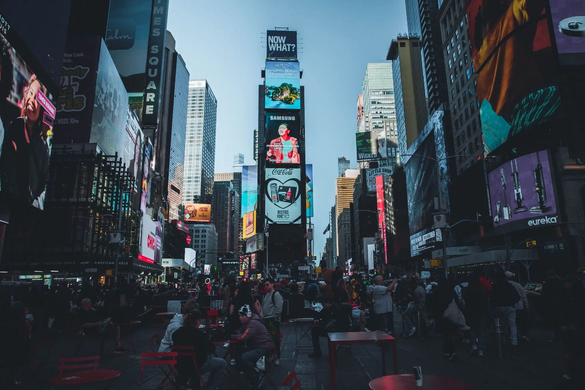     Times Square in New York City filled with digital billboards and pedestrians.