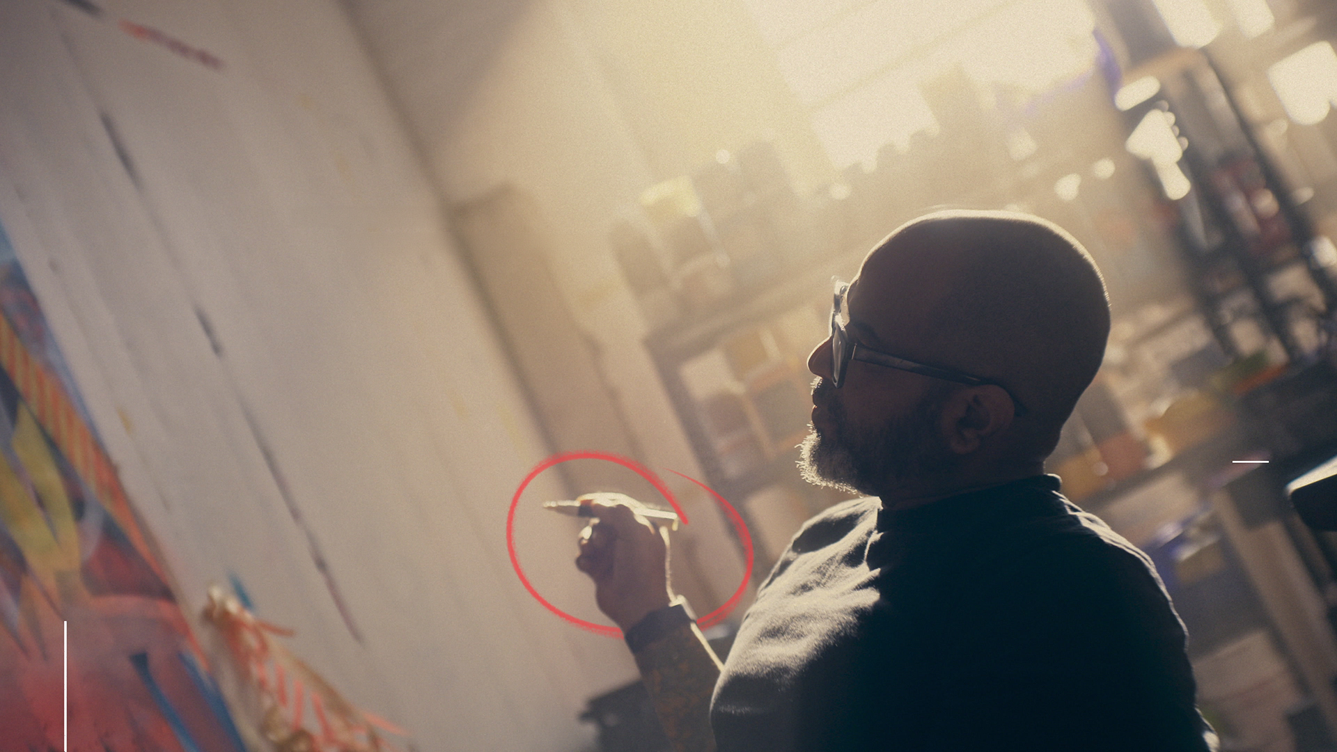 Artist painting a large-scale mural on a wall