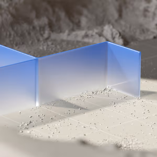 L-shaped translucent blue glass panel standing on a surface with small scattered debris.