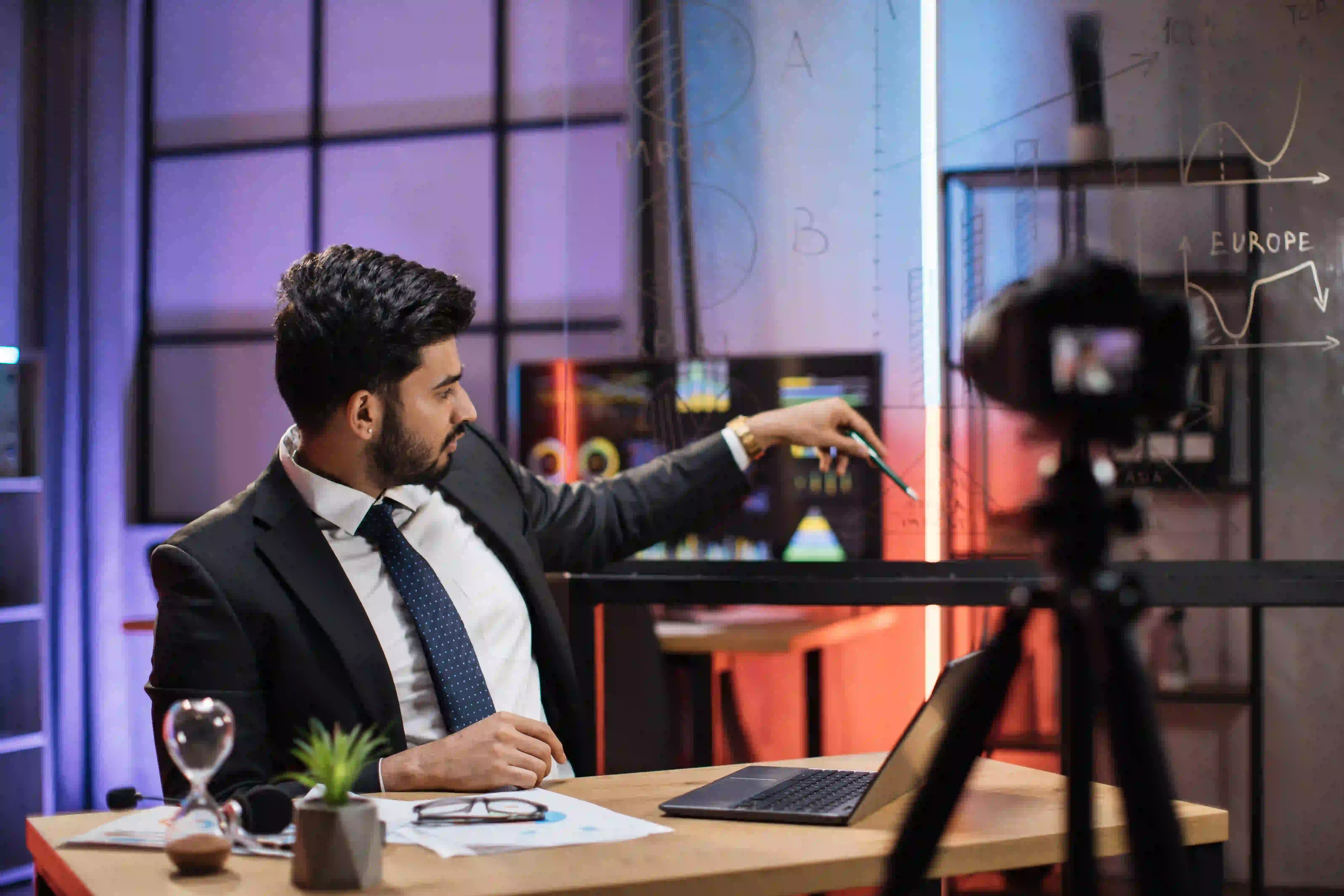 A corporate professional reviewing data and storyboards on a glass wall, demonstrating motion design and animation capabilities.