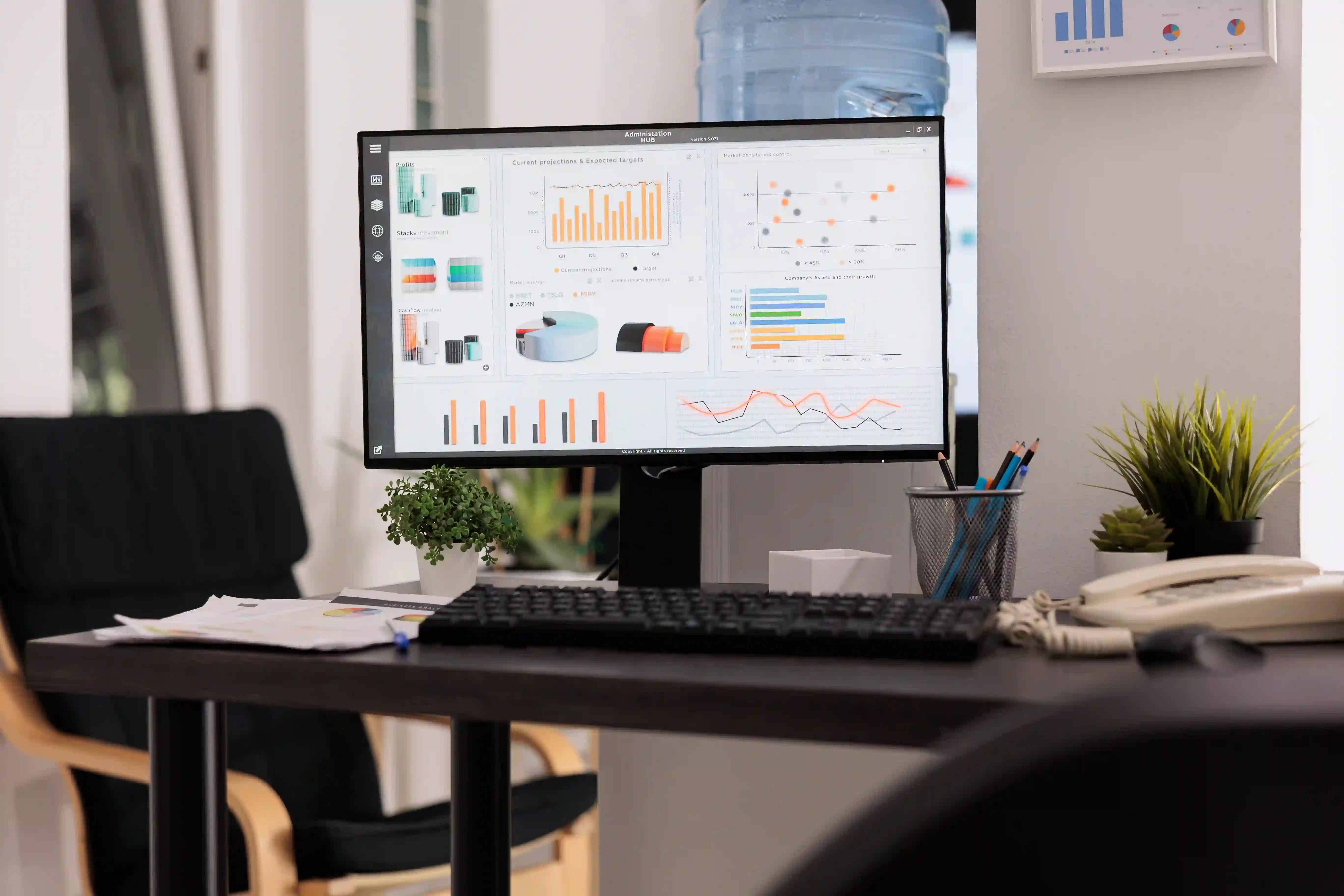 A workspace with a computer monitor displaying data dashboards, illustrating the proprietary analytics needed to build a discoverable evidence system.