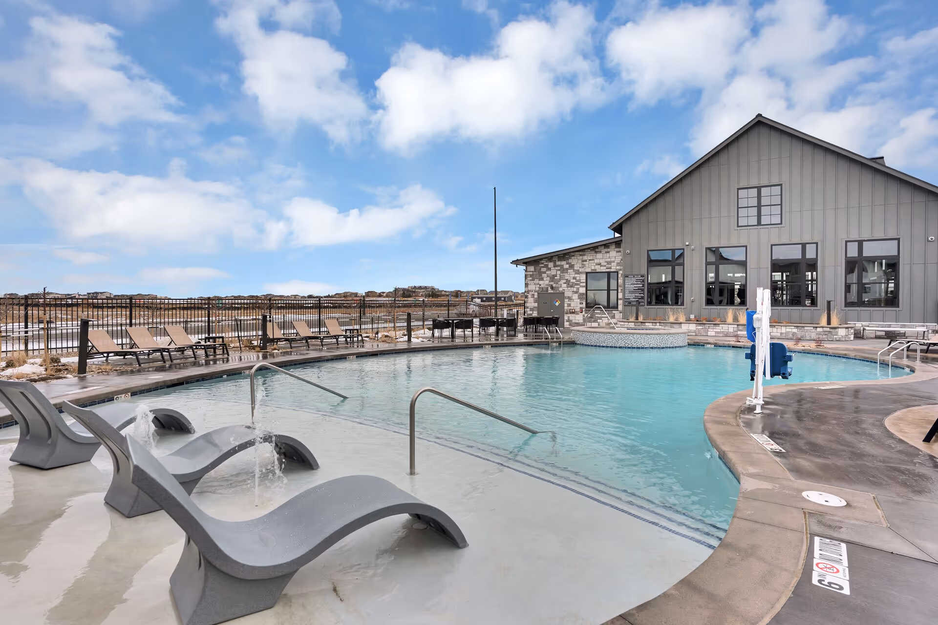 Outdoor pool with lounge seating