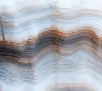 Close-up of layered blue and brown stone texture with wavy horizontal striations.
