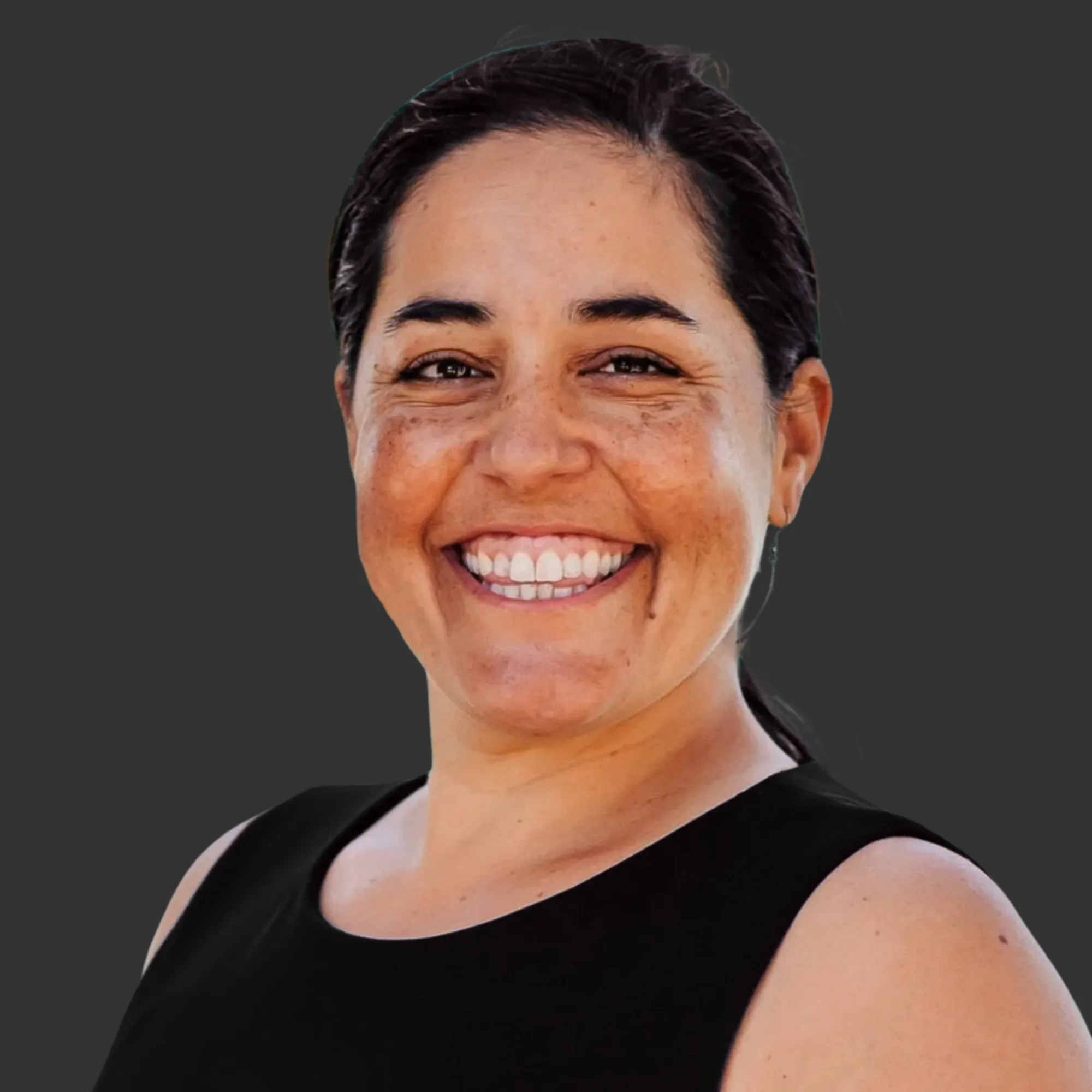 Professional headshot of Dr. Monica Montijo, Managing Partner at MMC, a woman with dark hair pulled back, wearing a black top, smiling warmly against a dark background.