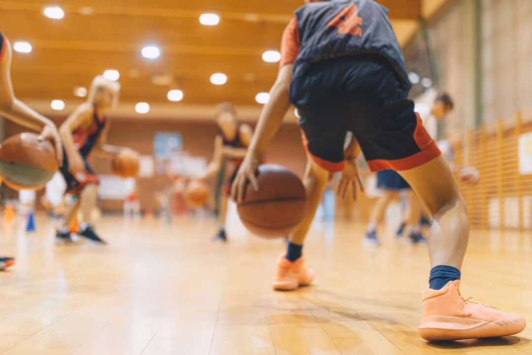 A close up of a middle school basketball game.