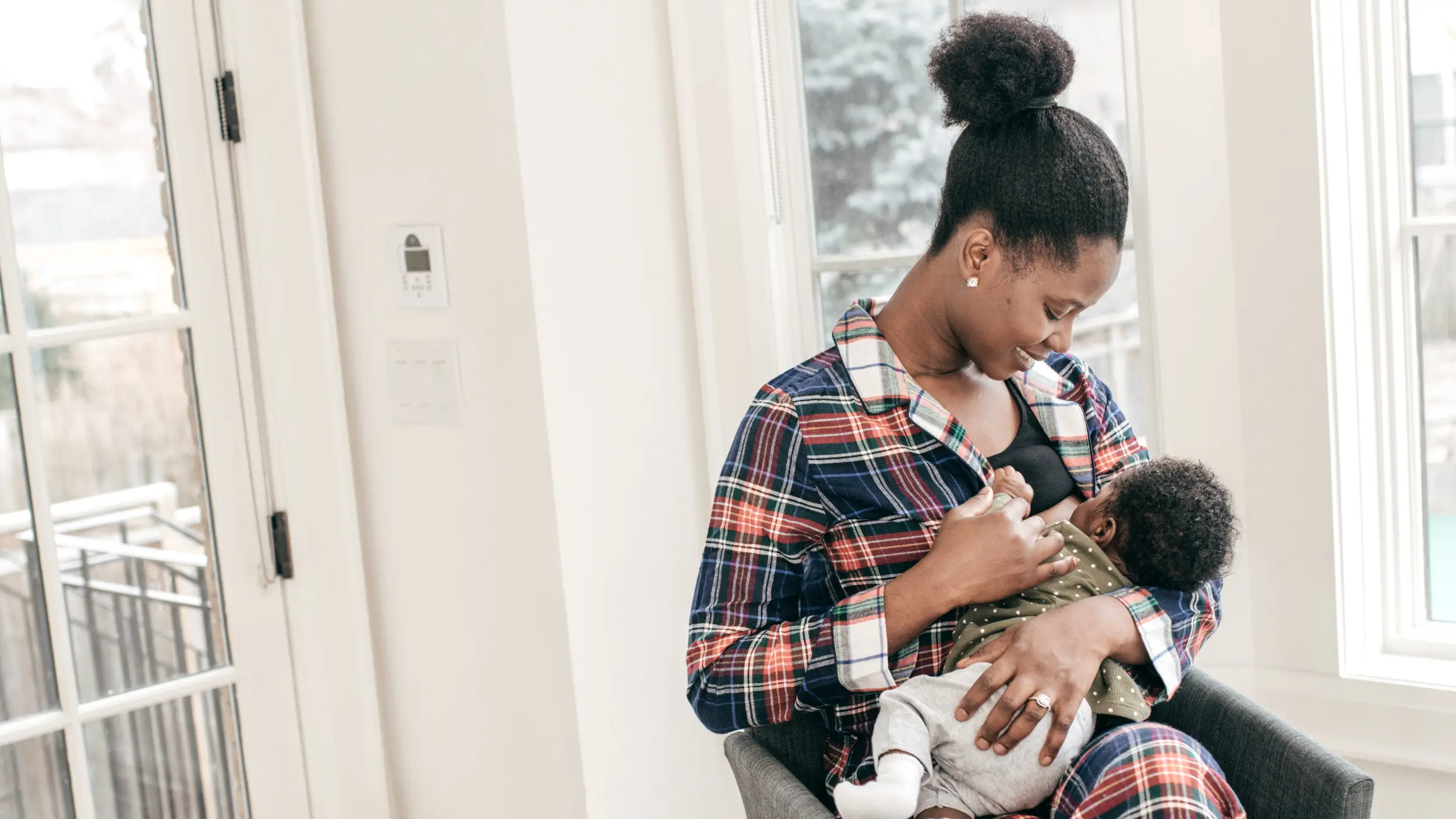 mother breastfeeding newborn child