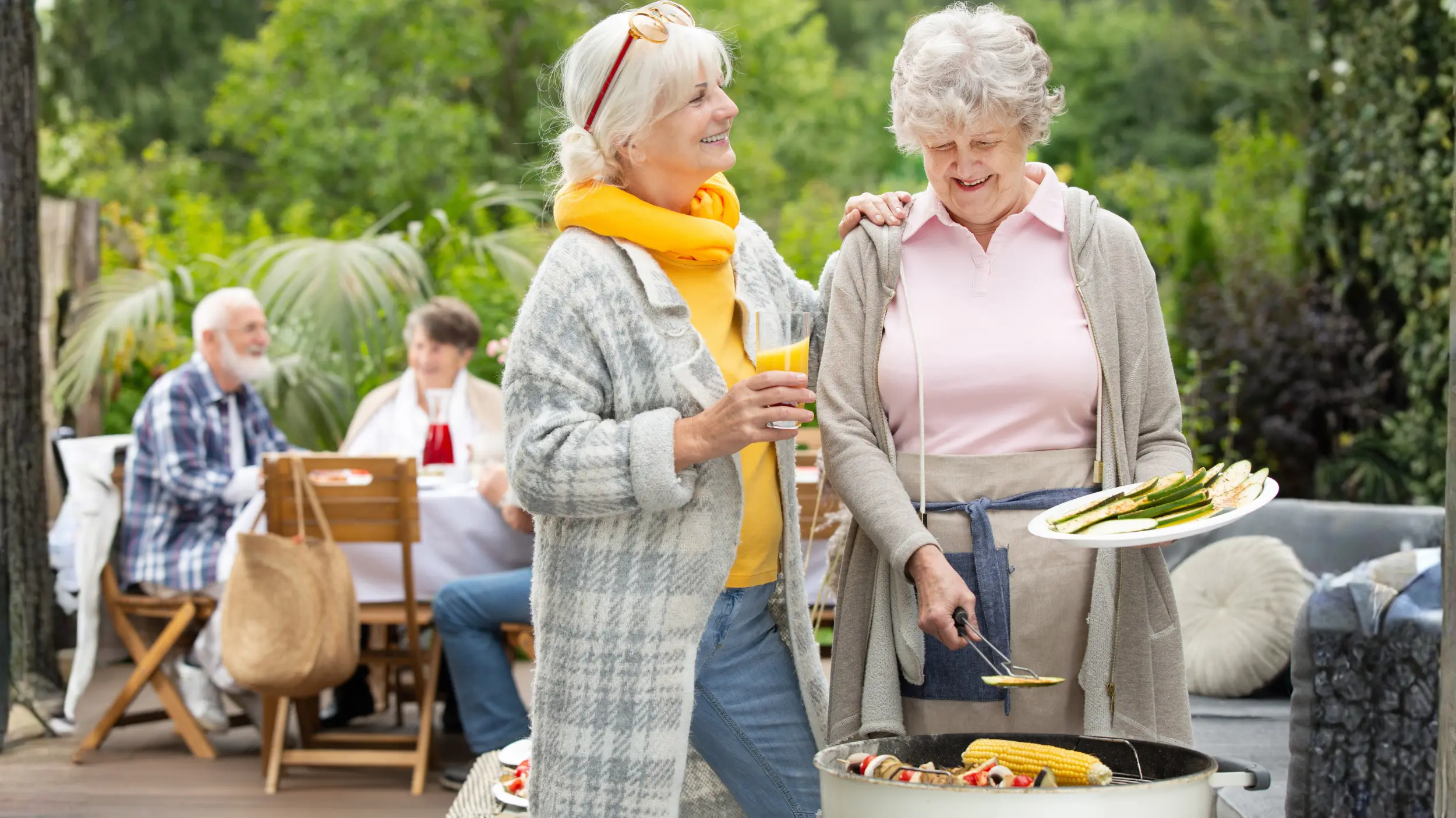 Middle aged women grilling vegetabels