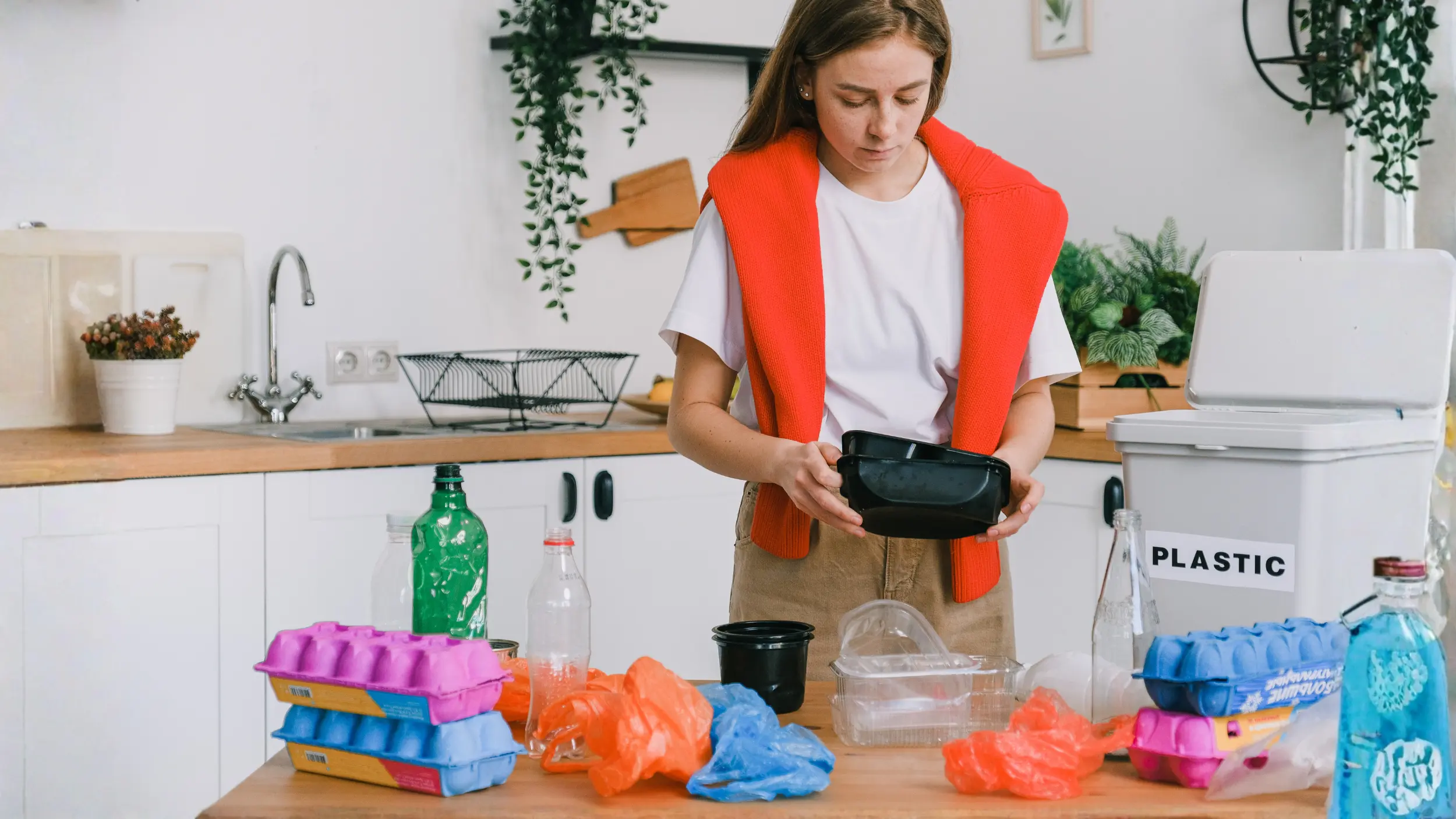 women in her kitchen with tupperware plastic