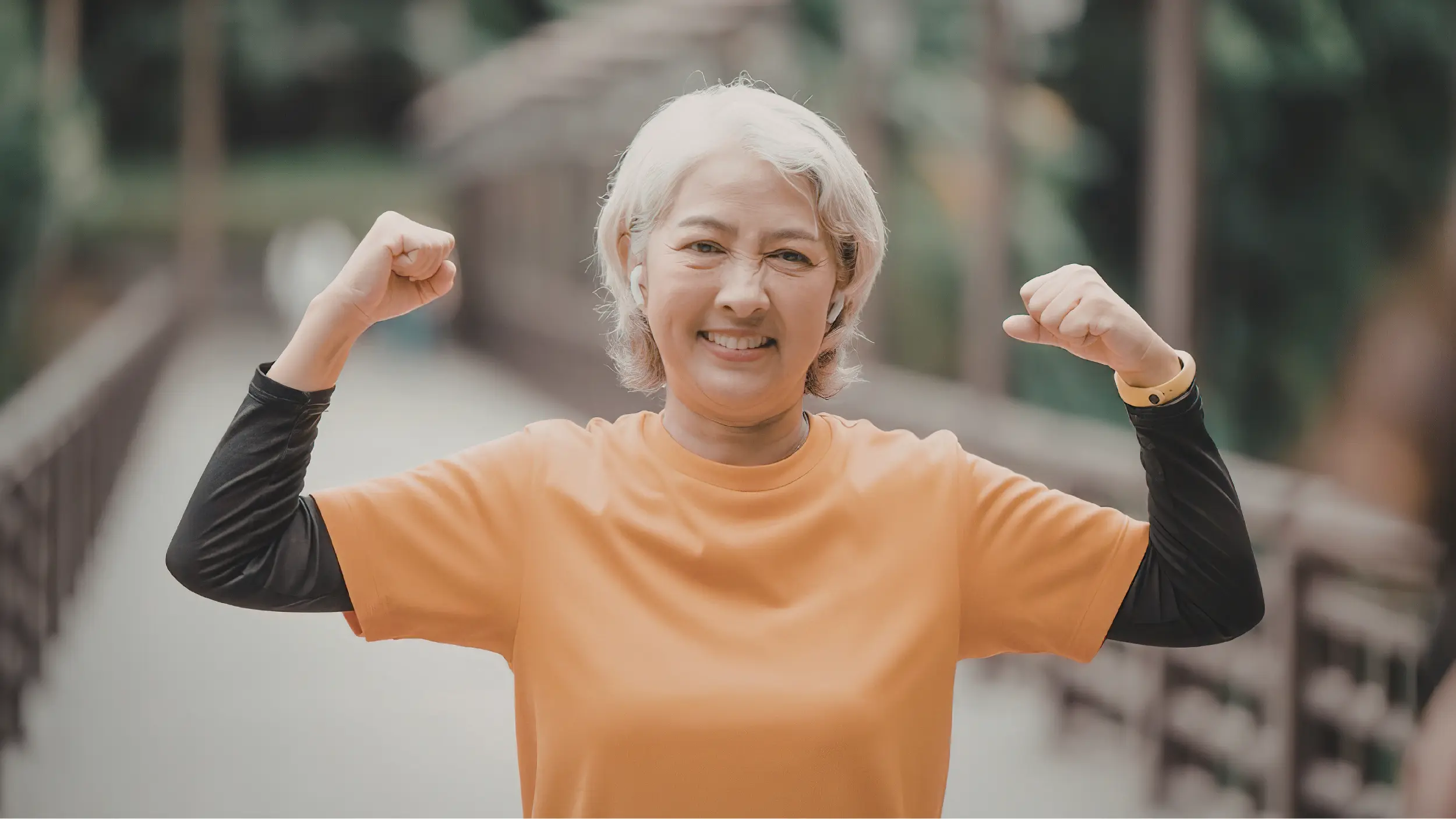 middle aged women who is strong showing her muscles