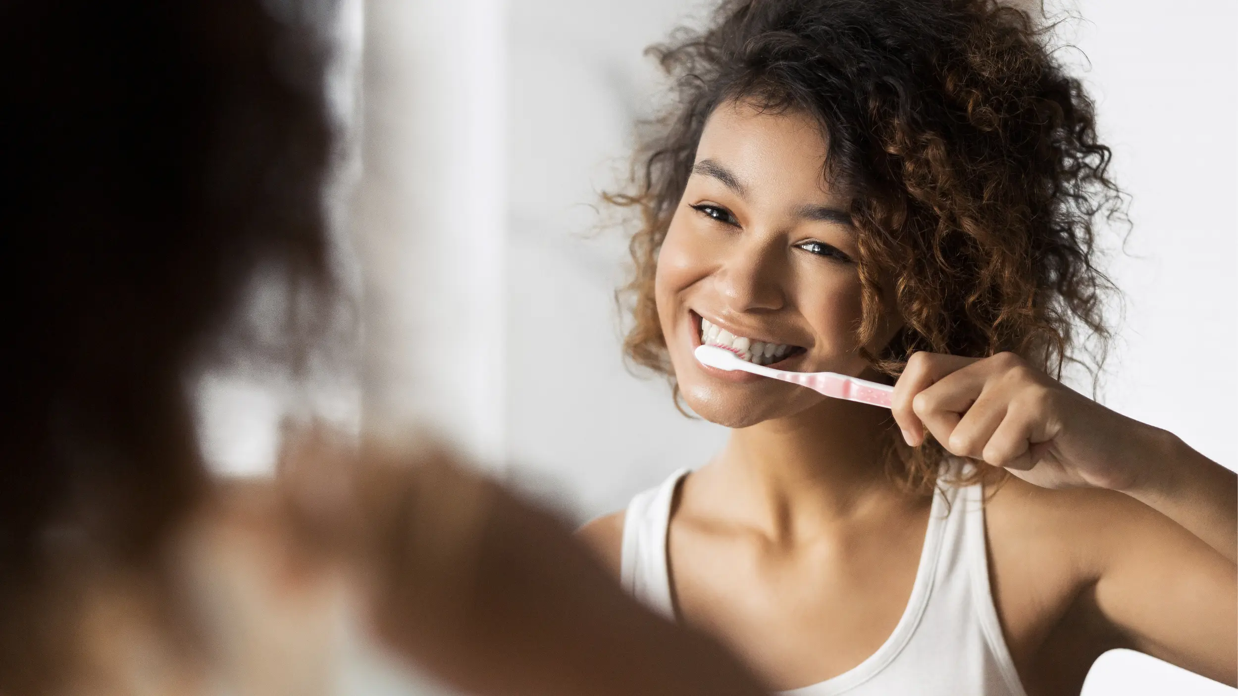 Woman brushing her teeth
